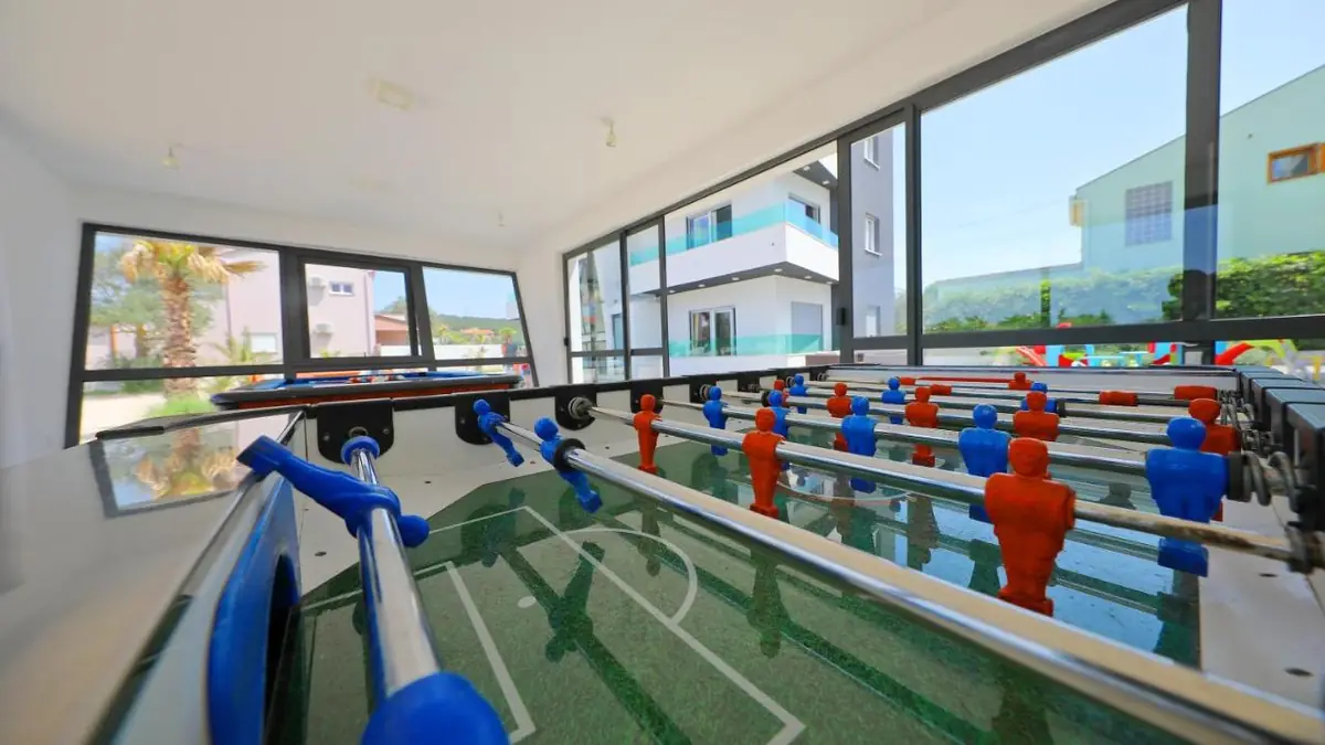 Spielzimmer mit Tischfußball von Boutique Apartments Blitz